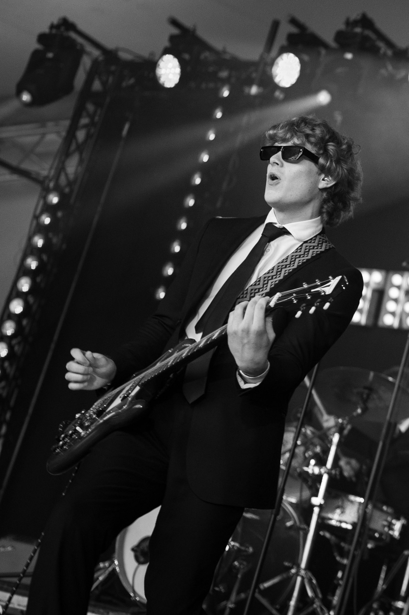Guitarist performing live in black and white